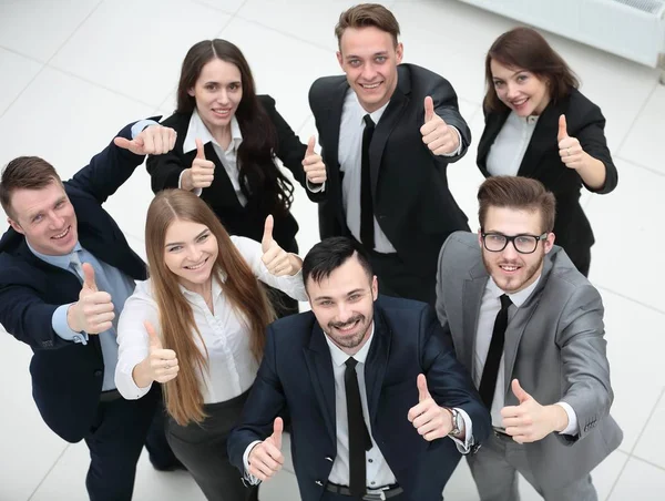 stock image successful business team holding up a thumbs up