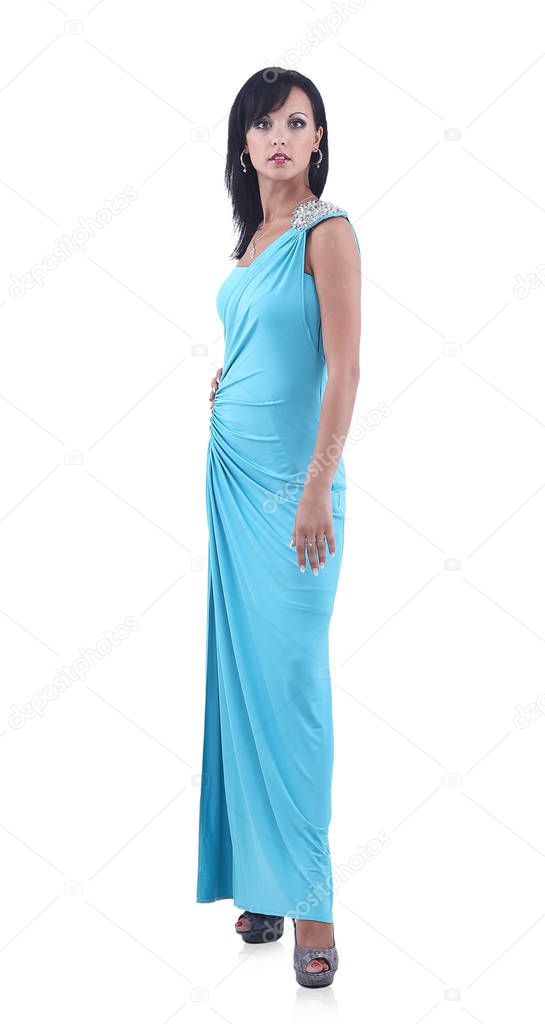 Beautiful woman in blue long dress posing on white background