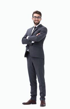 Elleri ceplerinde duran genç işadamı.