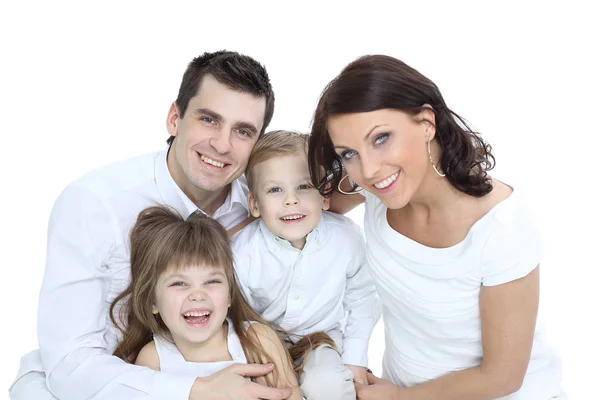 Sonriente madre y padre sosteniendo a sus hijos en casa —  Fotos de Stock