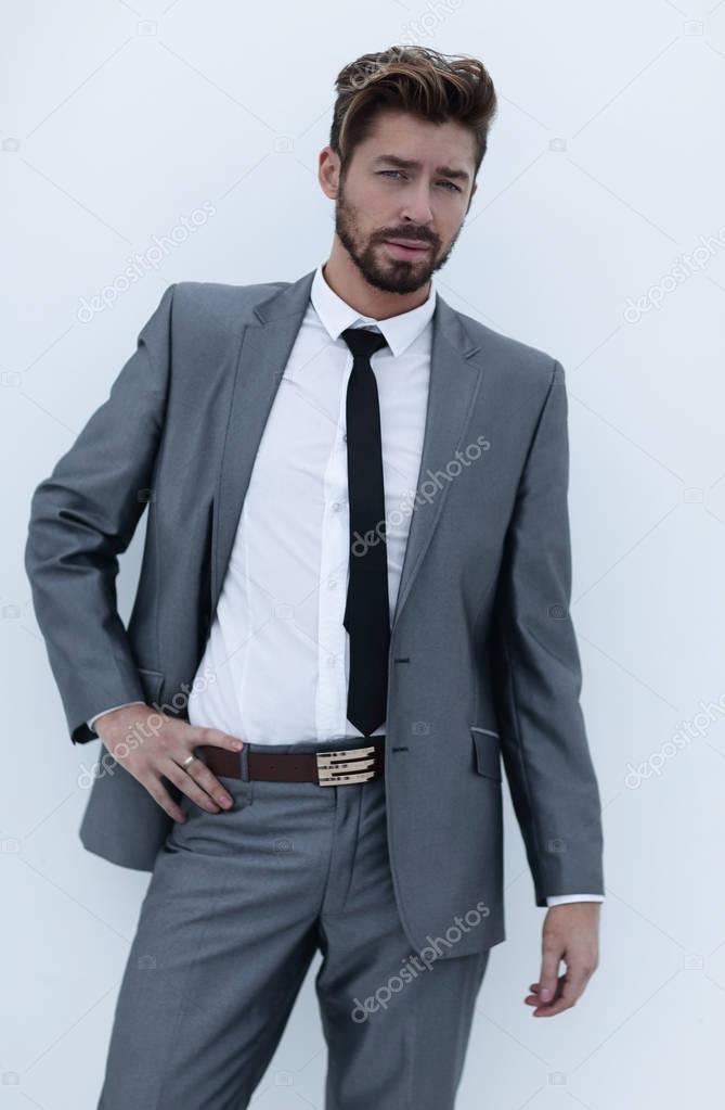 serious businessman with hands on hips, isolated background