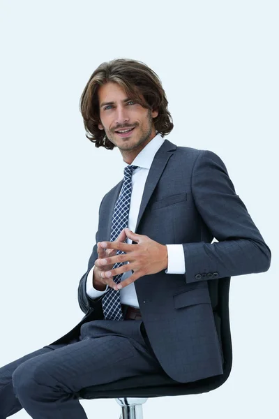 Inviting business man sitting on chair with relaxed attitude — Stock Photo, Image