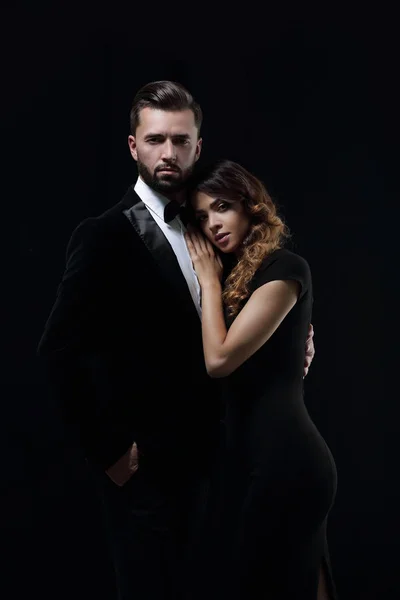 Portrait of fashion couple on black background — Stock Photo, Image