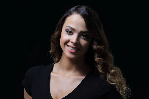 Portrait of a smiling woman on black background. Close-up. — Stock Photo, Image