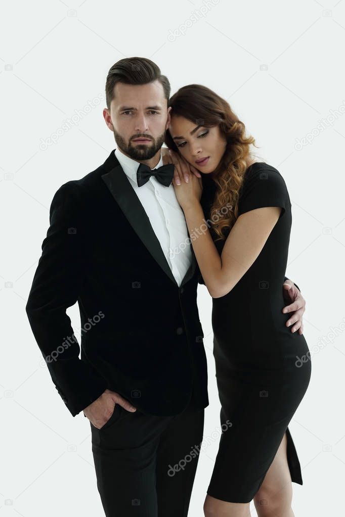 portrait of an elegant woman in a black dress hugging her lover