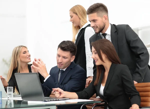 Business team discussing new information , standing in front of the open laptop — Stock Photo, Image