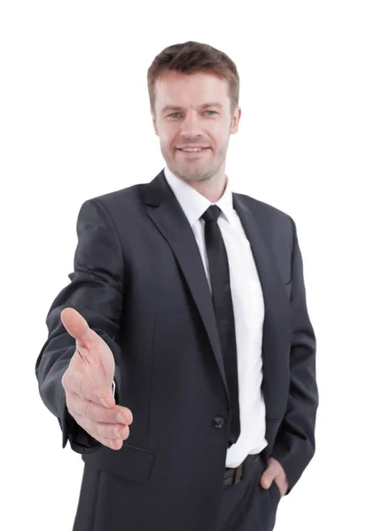 Handsome businessman holds out his hand for a handshake. Stock Photo