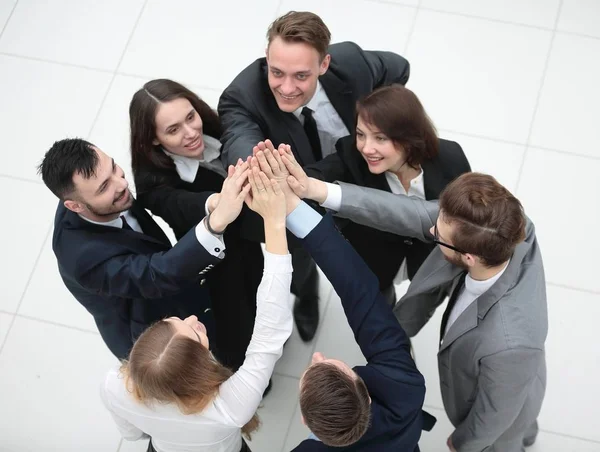Closeup. joyful business team with folded hands together — Stock Photo, Image