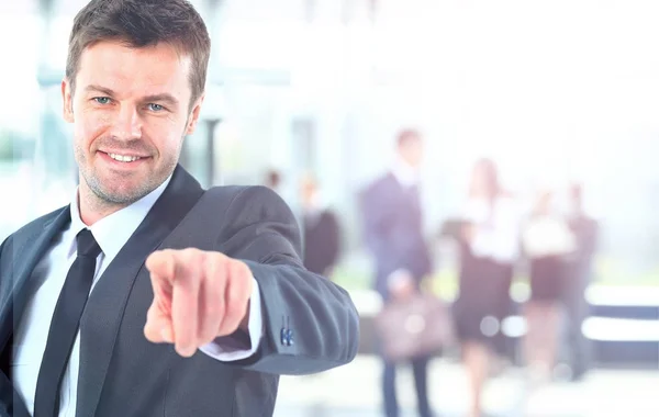 Portrait of smiling mature business man pointing at you in office — Stock Photo, Image