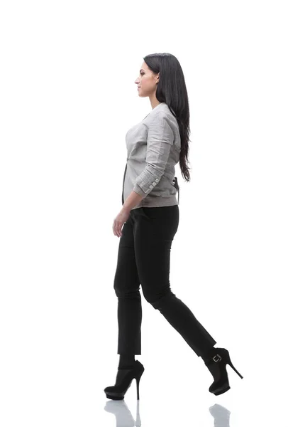 Full-length. side view. modern young woman confidently goes forward — Stock Photo, Image