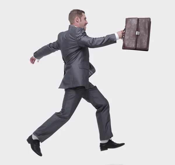 Side view.cheerful businessman with briefcase stepping forward — Stock Photo, Image