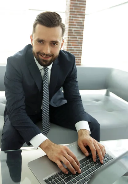 Employee of the company typing text on the laptop keyboard — Stock Photo, Image