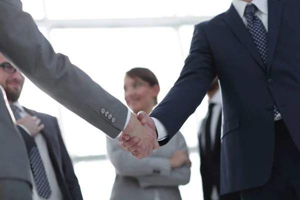 Hintergrundbild des Handschlags von Geschäftsleuten . — Stockfoto