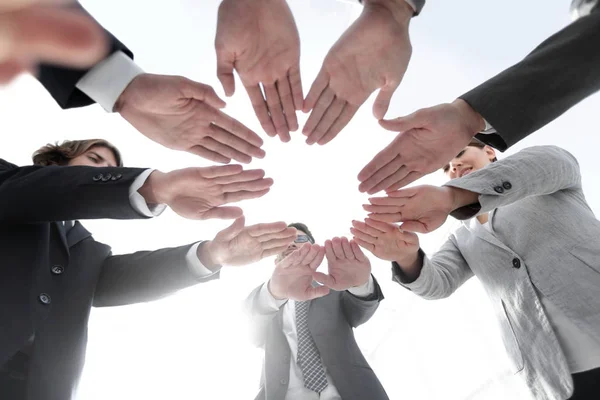 Business team with folded their hands in a circle — Stock Photo, Image