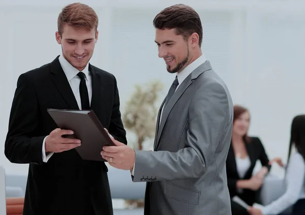 Two successful business partners discussing documents and ideas — Stock Photo, Image
