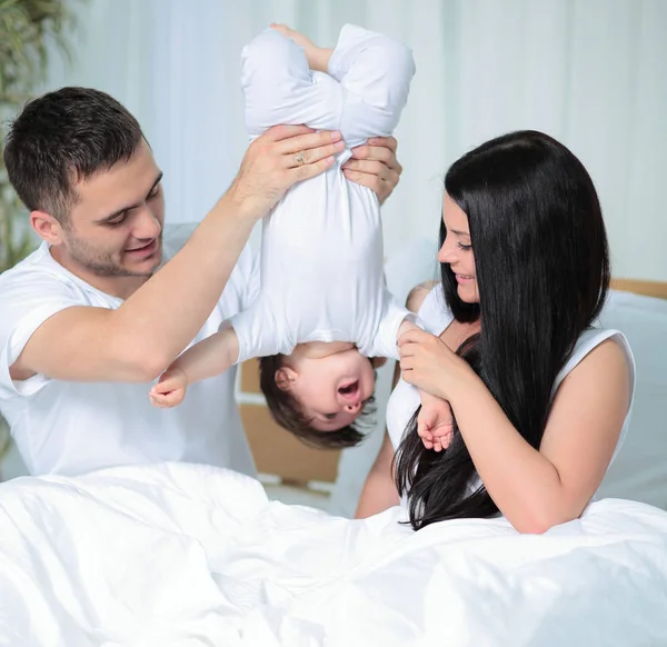Happy parents playing with their child — Stock Photo, Image