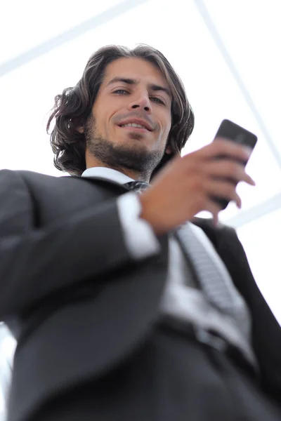 Bottom view.business men reading SMS on smartphone — Stock Photo, Image