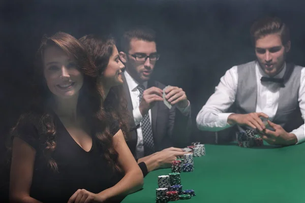 Modern business woman sitting at craps table in a casino. — Stock Photo, Image