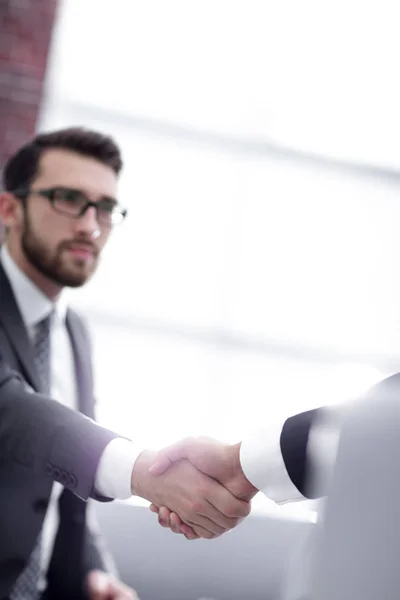 Businessman shaking hands in office — Stock Photo, Image