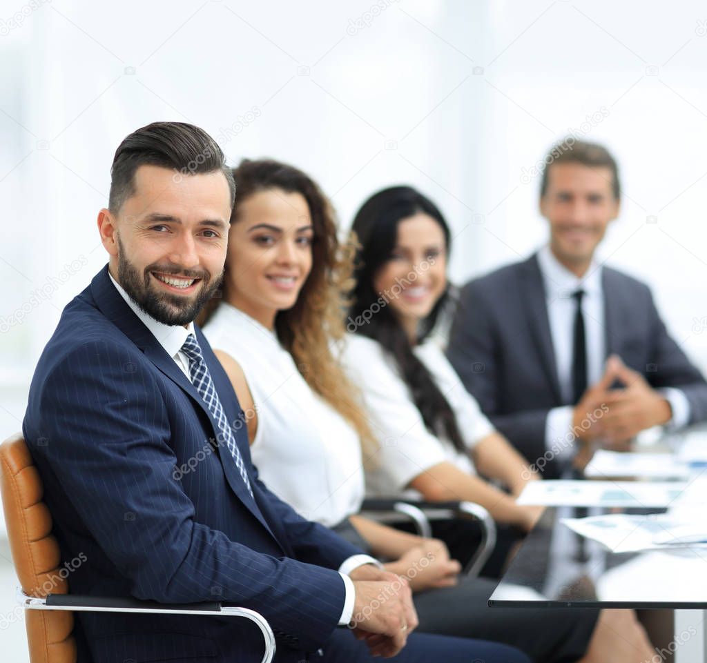 group of business people sitting at the desktop