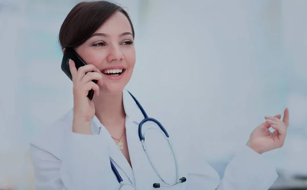 Doctor talking on telephone