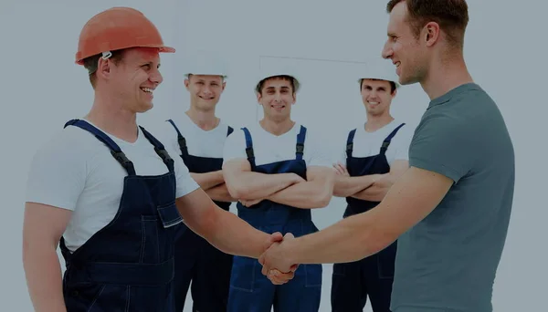 Cliente apertando as mãos com construtor — Fotografia de Stock