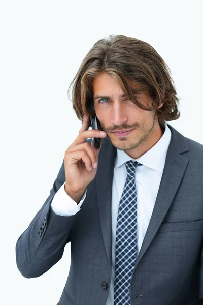 Young man listening on a phone on a white background — Stock Photo, Image