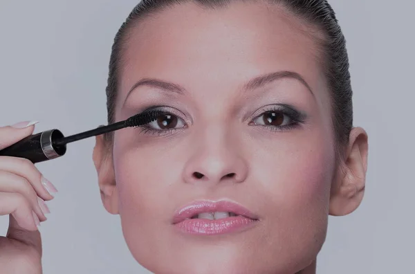 Beautiful woman is using mascara — Stock Photo, Image