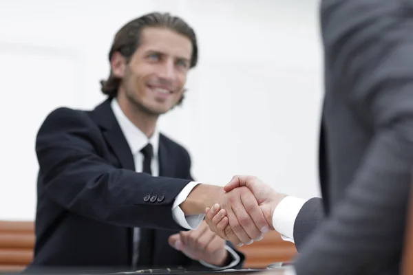 handshake Manager and the client sitting in the office