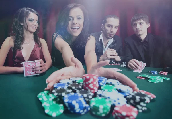 Stylish woman wins in the casino — Stock Photo, Image