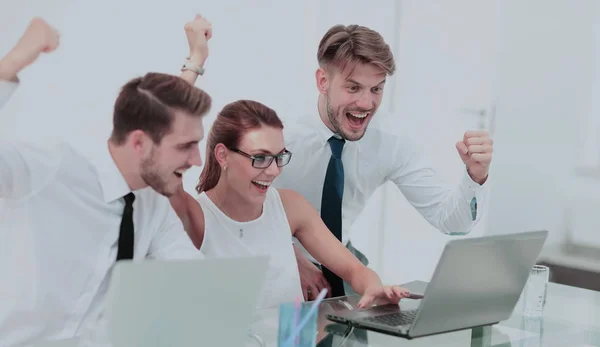 Picture of happy business team celebrating victory in office — Stock Photo, Image