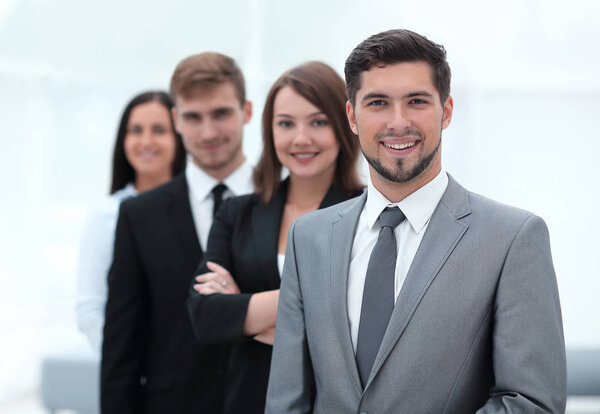 leader and the business team standing one behind the other.