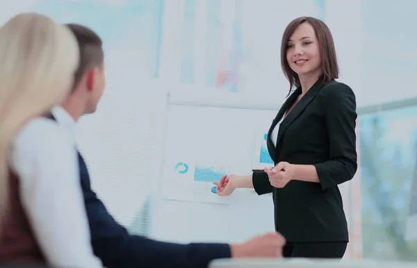 Businesswoman asking question during her colleagues presentation — Stock Photo, Image