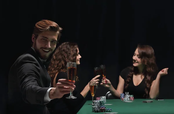 Happy group of people celebrating a successful game of poker — Stock Photo, Image