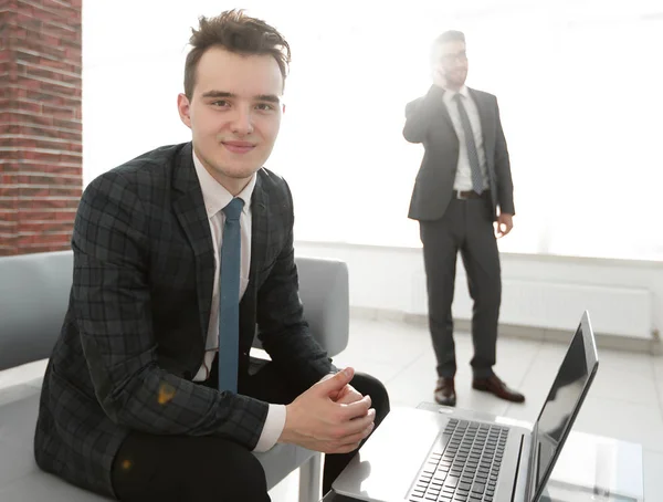 Young businessman working with laptop at office — Stock Photo, Image