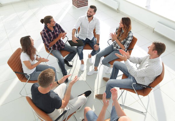 creative team holds a meeting in the lobby