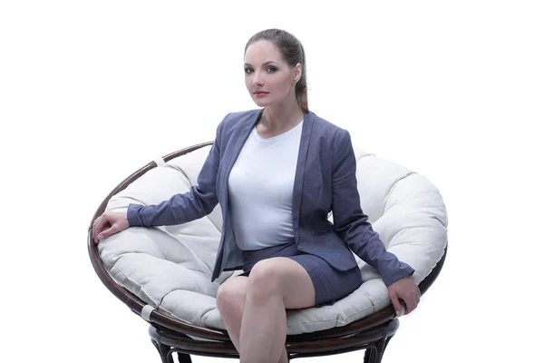 Business woman sitting in a round chair rattan — Stock Photo, Image