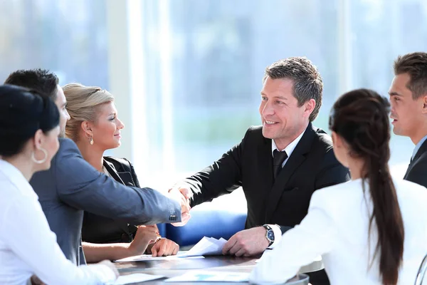 Two business partners shaking hands on meeting — Stock Photo, Image