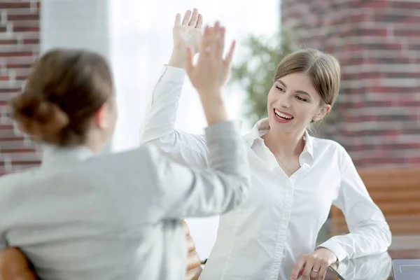 Members of the business team giving each other a high five. Royalty Free Stock Photos