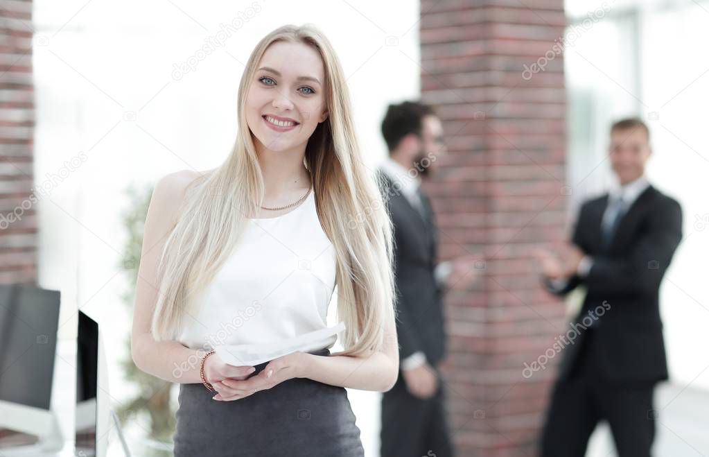 successful young business woman with financial graphs