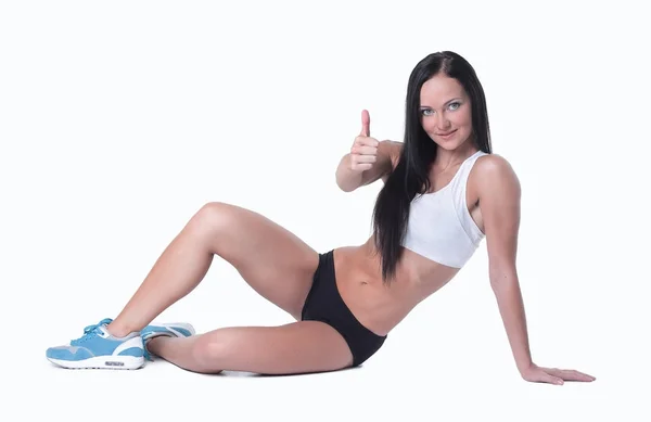 Sorrindo treinador feminino gesticulando polegares para cima — Fotografia de Stock