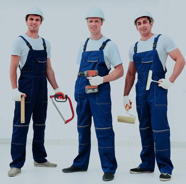 Group of professional industrial workers. Isolated over white background. — Stock Photo, Image