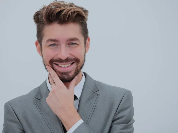 De cerca retrato de un hombre de negocios guapo sonriente sobre blanco — Foto de Stock