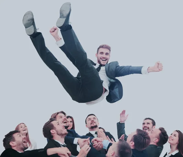 Business team throwing his colleague — Stock Photo, Image