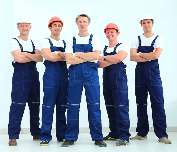 Team of professional builders in helmets — Stock Photo, Image