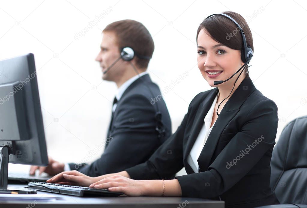 Female Customer Services Agent With Headset Working In A Call Center