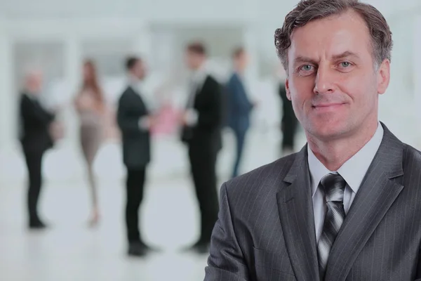 Happy mature business man looking at camera with satisfaction at office — Stock Photo, Image