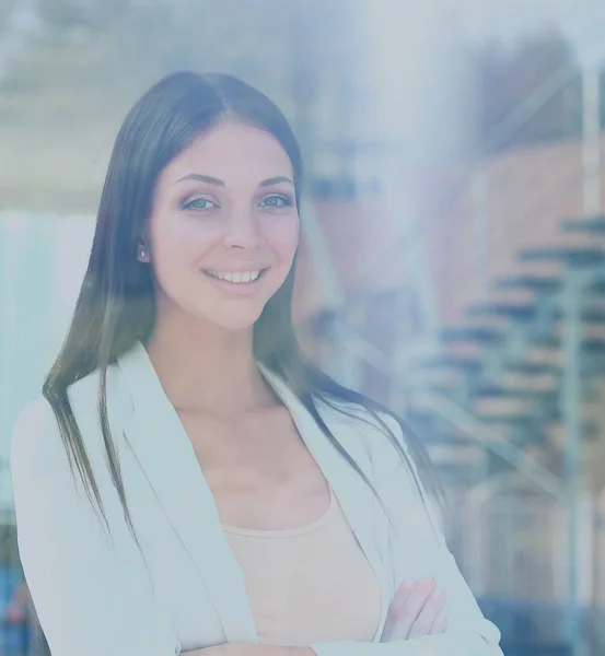 Business woman looking thtough window in the office — Stock Photo, Image