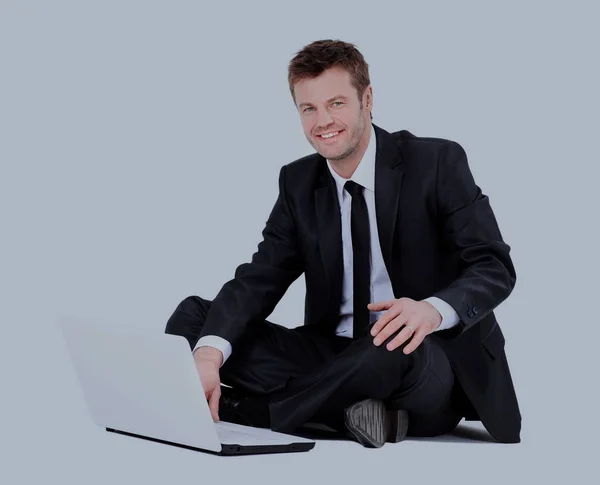 Bonito homem de negócios com laptop isolado no fundo branco — Fotografia de Stock