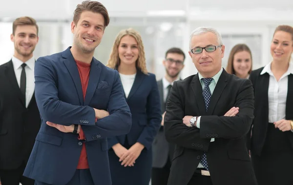 Business partners standing in front of the business team. — Stock Photo, Image